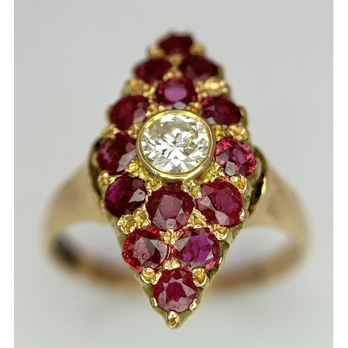 512 - A 14K Yellow Gold Ruby and Diamond Ring. Central diamond surrounded by 15 rubies in a marquise shape... 