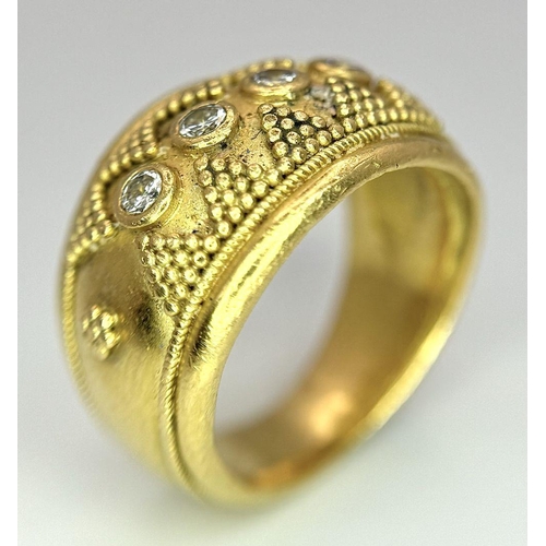 61 - A 22K Yellow Gold Four Stone Diamond Ring. Etruscan style wide band ring with beaded geometric decor... 