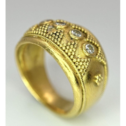 61 - A 22K Yellow Gold Four Stone Diamond Ring. Etruscan style wide band ring with beaded geometric decor... 