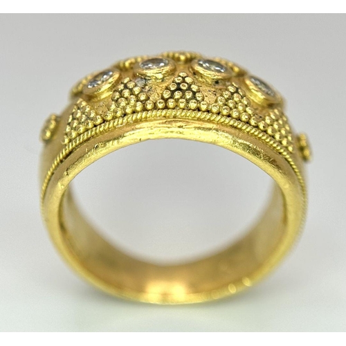 61 - A 22K Yellow Gold Four Stone Diamond Ring. Etruscan style wide band ring with beaded geometric decor... 