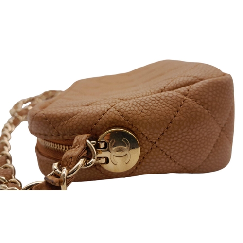 64 - A Chanel Tan Mini Coco Camera Tassel Crossbody Bag. Quilted caviar leather exterior with gold-toned ... 