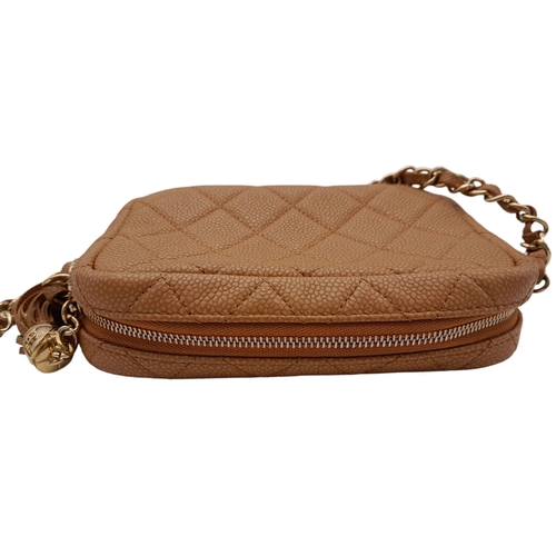 64 - A Chanel Tan Mini Coco Camera Tassel Crossbody Bag. Quilted caviar leather exterior with gold-toned ... 