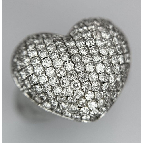 68 - An 18K White Gold Diamond Pave Heart Ring. 1.2ctw of pave round cut diamonds in heart form. Size H (... 