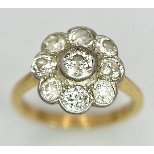 89 - An Antique 18K Yellow Gold (Tested) Diamond Ring in Floral Form. Nine round cut diamonds of 1.6ctw c... 