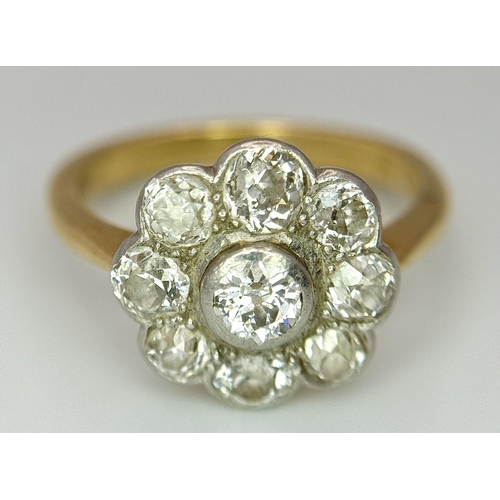 89 - An Antique 18K Yellow Gold (Tested) Diamond Ring in Floral Form. Nine round cut diamonds of 1.6ctw c... 