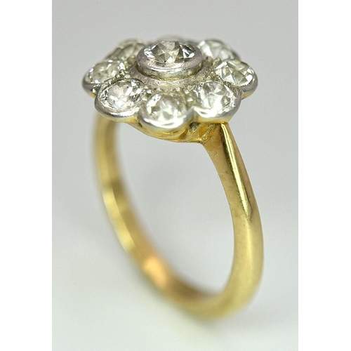 89 - An Antique 18K Yellow Gold (Tested) Diamond Ring in Floral Form. Nine round cut diamonds of 1.6ctw c... 