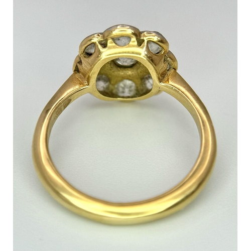 89 - An Antique 18K Yellow Gold (Tested) Diamond Ring in Floral Form. Nine round cut diamonds of 1.6ctw c... 