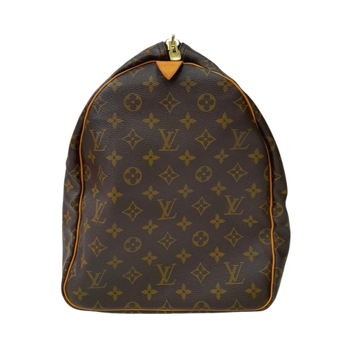 101 - A Louis Vuitton Keepall 55 Travel Bag. Monogram coated canvas exterior with leather trim, two rolled... 