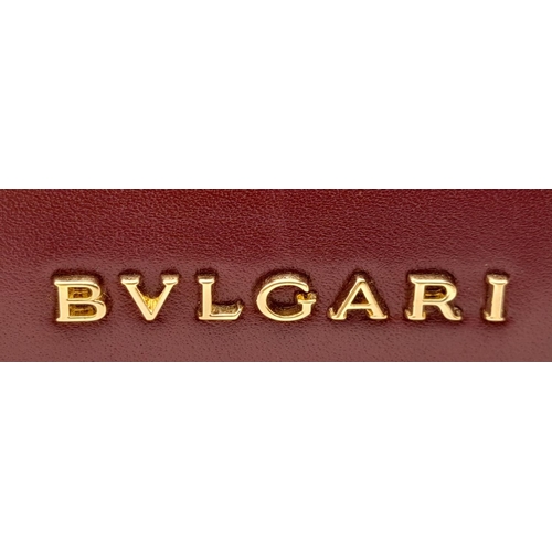 108 - A Bvlgari Burgundy Colour Block Serpenti Handbag. Leather exterior with gold-toned hardware, adjusta... 