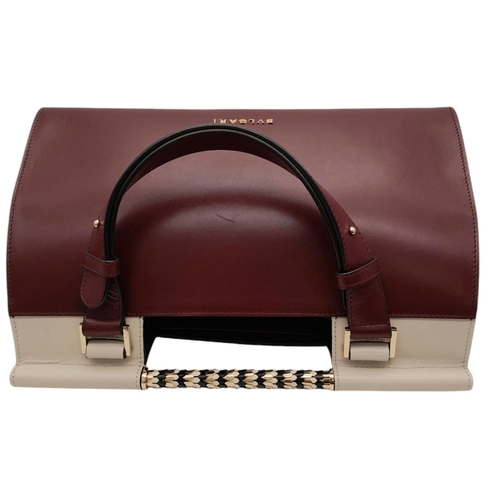 108 - A Bvlgari Burgundy Colour Block Serpenti Handbag. Leather exterior with gold-toned hardware, adjusta... 