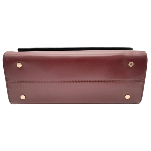 108 - A Bvlgari Burgundy Colour Block Serpenti Handbag. Leather exterior with gold-toned hardware, adjusta... 