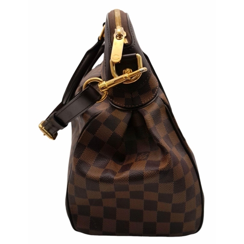 115 - A Louis Vuitton Damier Ebene Trevi Bag. Coated canvas exterior with leather trim, gold-toned hardwar... 