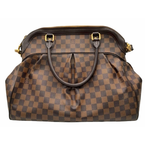 115 - A Louis Vuitton Damier Ebene Trevi Bag. Coated canvas exterior with leather trim, gold-toned hardwar... 