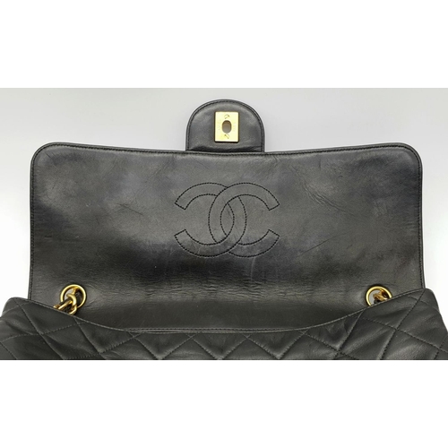 29 - A Chanel Black Crossbody Bag. Matelassé leather exterior with gold-toned hardware, chain and leather... 