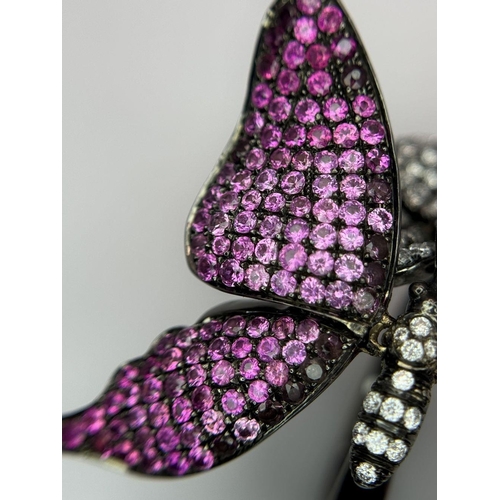 54 - An Enchanting 18K Gold, Diamond and Ruby Butterfly Dress Ring. A pave ruby large wingspan butterfly ... 