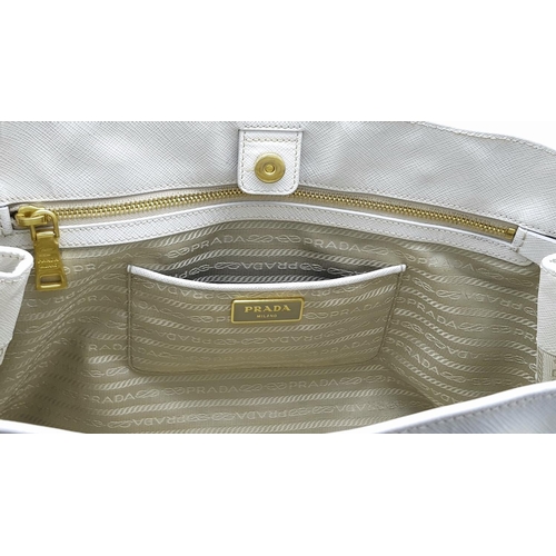 57 - A Prada Cream Galleria Handbag. Saffiano leather exterior with gold-toned hardware, two rolled handl... 