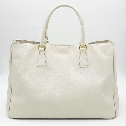 57 - A Prada Cream Galleria Handbag. Saffiano leather exterior with gold-toned hardware, two rolled handl... 