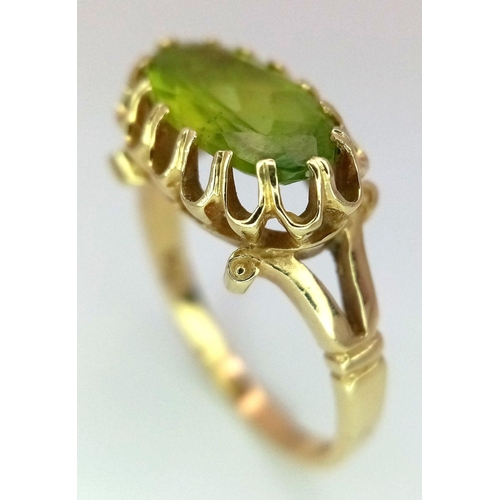 70 - Impressive and elegant 14 carat GOLD RING, having a long Oval Cut PERIDOT GEMSTONE in an Attractive ... 