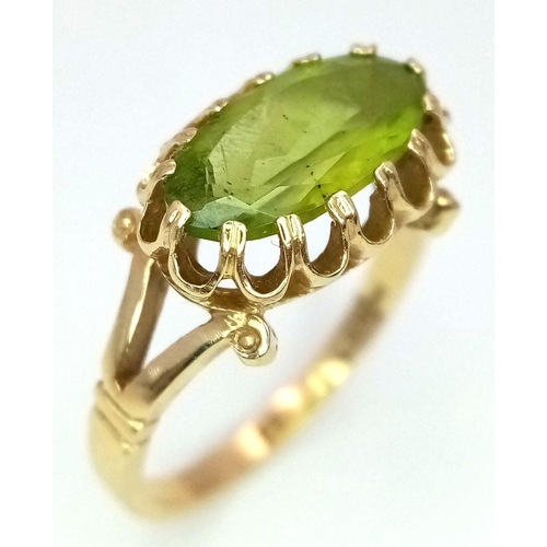 70 - Impressive and elegant 14 carat GOLD RING, having a long Oval Cut PERIDOT GEMSTONE in an Attractive ... 