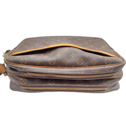 92 - A Louis Vuitton monogram reporter GM shoulder bag, with both padlock and keys present and an adjusta... 