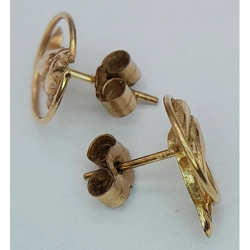 14 - Classic pair of 9 CARAT GOLD DOLPHIN STUD EARRINGS.Consisting Dolphins swimming through hoops. Compl... 