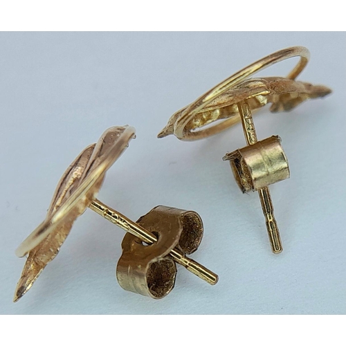 14 - Classic pair of 9 CARAT GOLD DOLPHIN STUD EARRINGS.Consisting Dolphins swimming through hoops. Compl... 