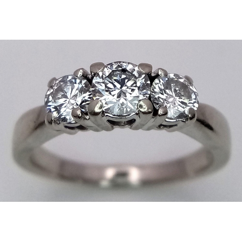 144 - A 14K WHITE GOLD DIAMOND 3 STONE RING - 0.80CT. 4G. SIZE N. A/S 1149