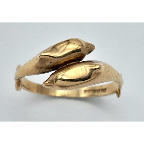 21 - An appealing 9 CARAT GOLD DOUBLE DOLPHIN RING. Full UK Hallmark. 1.8 grams. Size K - K 1/2. Please s... 