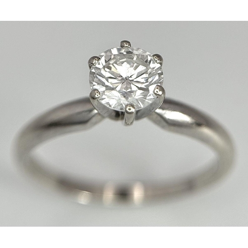 268 - A 14K White Gold Diamond Solitaire Ring. A Near white 0.65ct brilliant round cut diamond. Ref: 18455