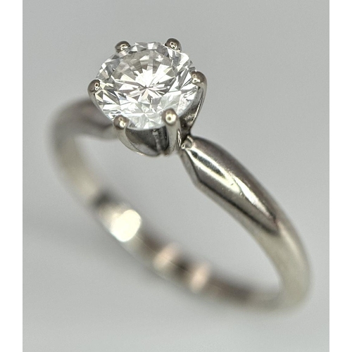268 - A 14K White Gold Diamond Solitaire Ring. A Near white 0.65ct brilliant round cut diamond. Ref: 18455