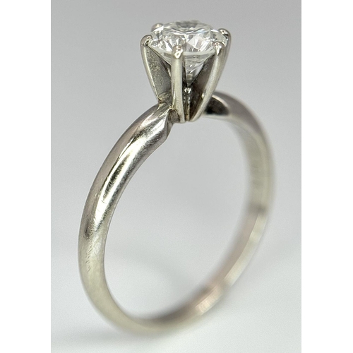 268 - A 14K White Gold Diamond Solitaire Ring. A Near white 0.65ct brilliant round cut diamond. Ref: 18455