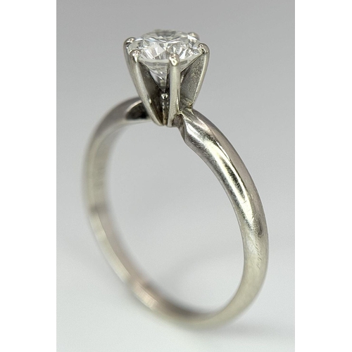 268 - A 14K White Gold Diamond Solitaire Ring. A Near white 0.65ct brilliant round cut diamond. Ref: 18455