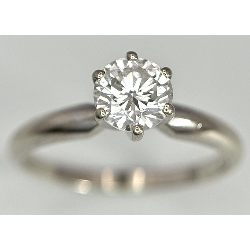 268 - A 14K White Gold Diamond Solitaire Ring. A Near white 0.65ct brilliant round cut diamond. Ref: 18455