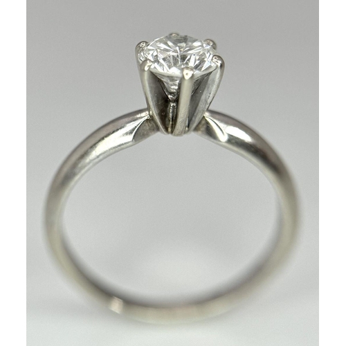 268 - A 14K White Gold Diamond Solitaire Ring. A Near white 0.65ct brilliant round cut diamond. Ref: 18455