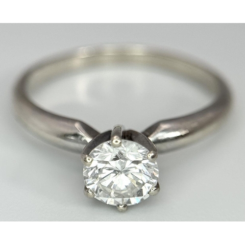 268 - A 14K White Gold Diamond Solitaire Ring. A Near white 0.65ct brilliant round cut diamond. Ref: 18455