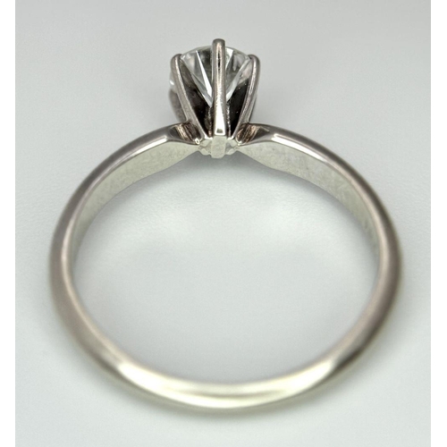 268 - A 14K White Gold Diamond Solitaire Ring. A Near white 0.65ct brilliant round cut diamond. Ref: 18455