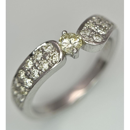 46 - A 18K WHITE GOLD DIAMOND SET RING 0.60CT 3.8G SIZE M 1/2. Ref: SC 2082