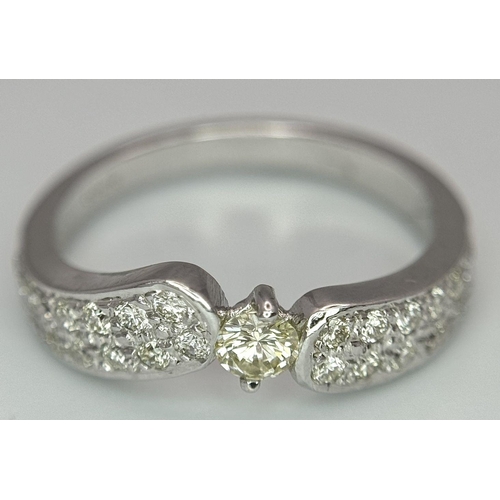 46 - A 18K WHITE GOLD DIAMOND SET RING 0.60CT 3.8G SIZE M 1/2. Ref: SC 2082