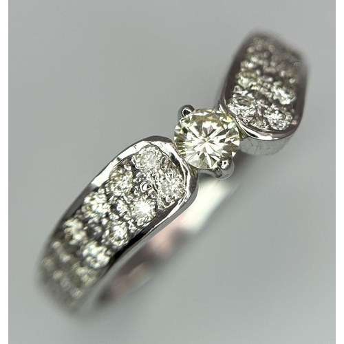 46 - A 18K WHITE GOLD DIAMOND SET RING 0.60CT 3.8G SIZE M 1/2. Ref: SC 2082