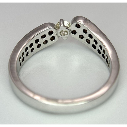 46 - A 18K WHITE GOLD DIAMOND SET RING 0.60CT 3.8G SIZE M 1/2. Ref: SC 2082