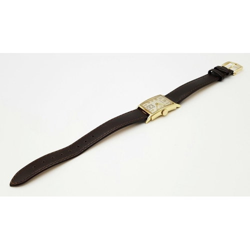 83 - A Vintage Hamilton 14K Gold Gents Tank Watch. Brown leather strap. 14k gold tank case - 27 x 21mm. C... 