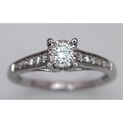 1340 - A 9K white gold diamond ring with diamond set shoulders, size N, (dia:0.25ct). Total weight 2g. Ref ... 