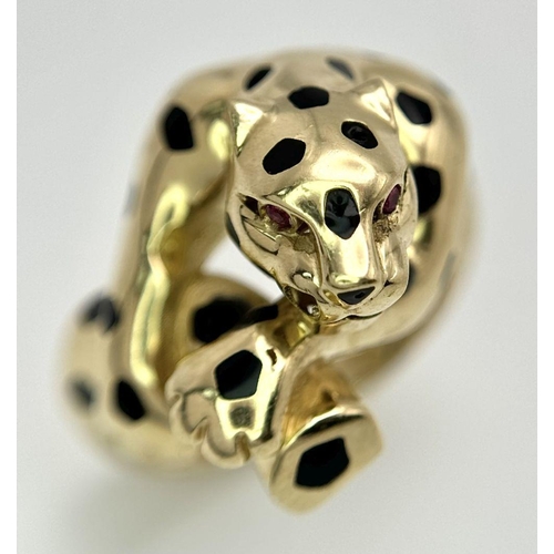 32 - A 14K YELLOW GOLD PANTHER DESIGN RING WITH RED STONE SET EYES 6.6G SIZE Q 1/2. Ref: SC 2065