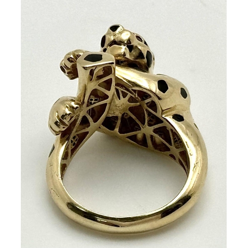 32 - A 14K YELLOW GOLD PANTHER DESIGN RING WITH RED STONE SET EYES 6.6G SIZE Q 1/2. Ref: SC 2065