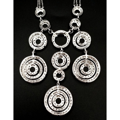 40 - A 14K White Gold and Diamond Galaxy-Esque Pendant and three strand necklace. A hanging pendant with ... 