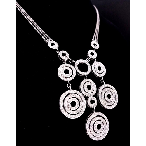 40 - A 14K White Gold and Diamond Galaxy-Esque Pendant and three strand necklace. A hanging pendant with ... 