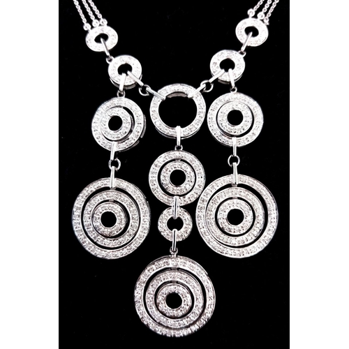 40 - A 14K White Gold and Diamond Galaxy-Esque Pendant and three strand necklace. A hanging pendant with ... 