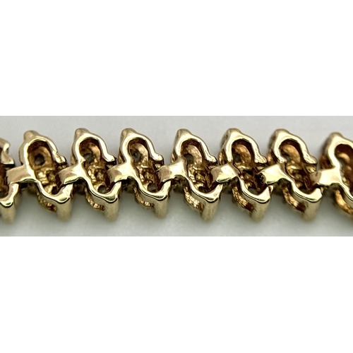 53 - A 9K YELLOW GOLD DIAMOND SET BRACELET 1CT 11.7G TOTAL WEIGHT, 21CM LENGTH.

ref: SC 2021