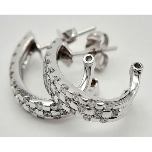 67 - A PAIR OF 18K WHITE GOLD DIAMOND SET EARRINGS. 5.2G.