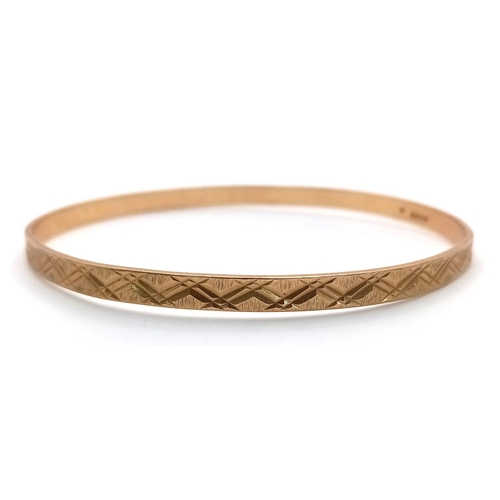 116 - A 9K yellow gold engraved bangle, 9.5g total weight, 6.5cm diameter. Ref: SH1678I